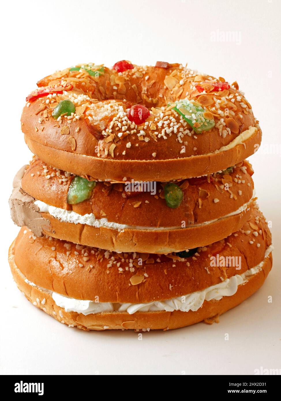 Roscón de Reyes with cream, custard and chocolate. Typical hispanic pastry.  . Stock Photo