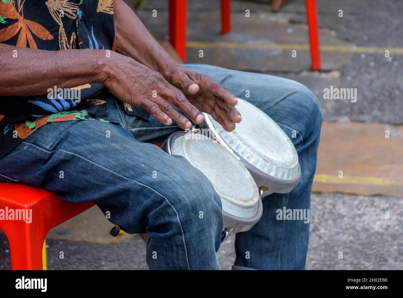 Bongos drum player in the streets of Salvador city during brazilian samba presentation. Stock Photo