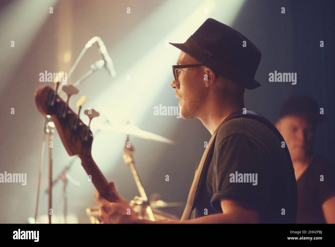 A young guitarist performing on stage. This concert was created for the