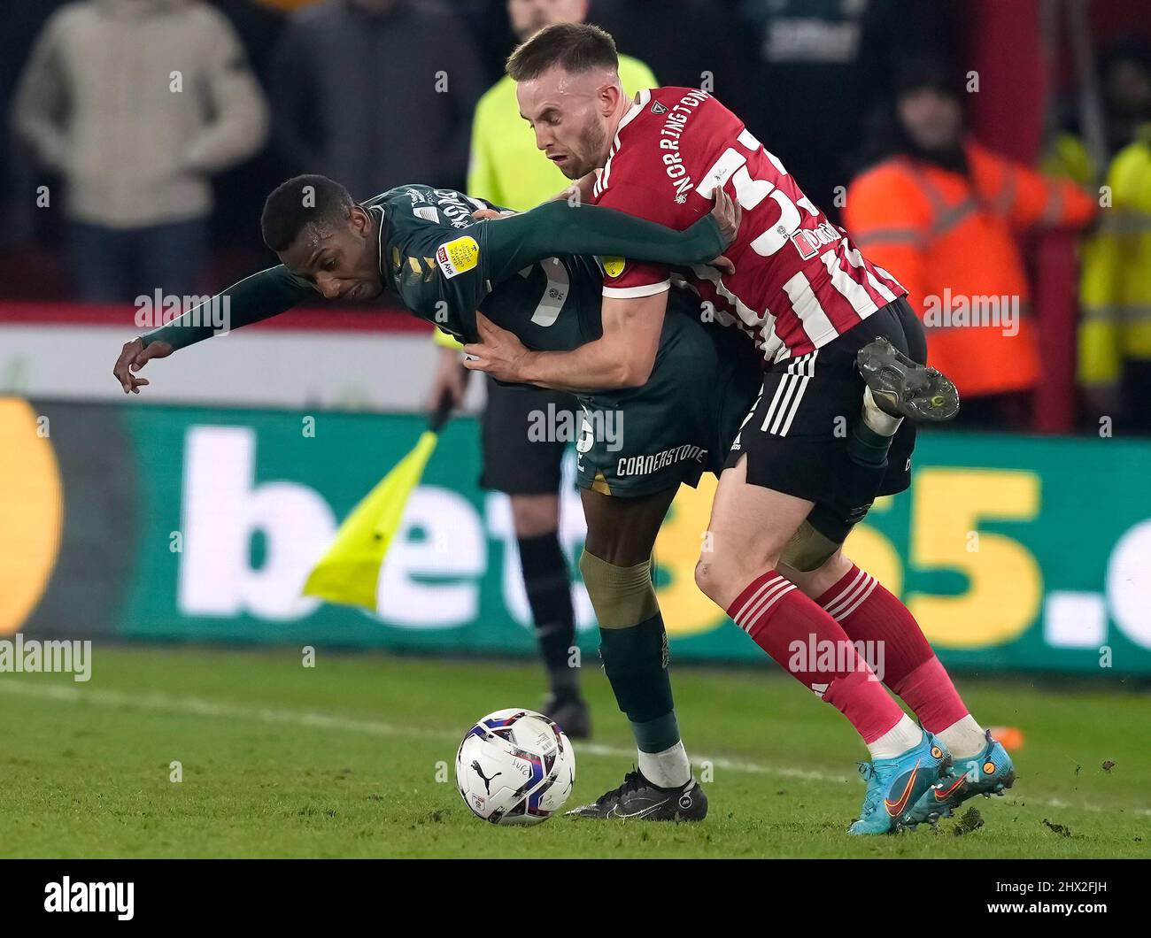 Sheffield, England, 8th March 2022. Rhys Norrington Davies of Sheffield Utd (R) challenges Isaiah Jones of Middlesbrough during the Sky Bet Championship match at Bramall Lane, Sheffield. Picture credit should read: Andrew Yates / Sportimage Stock Photo