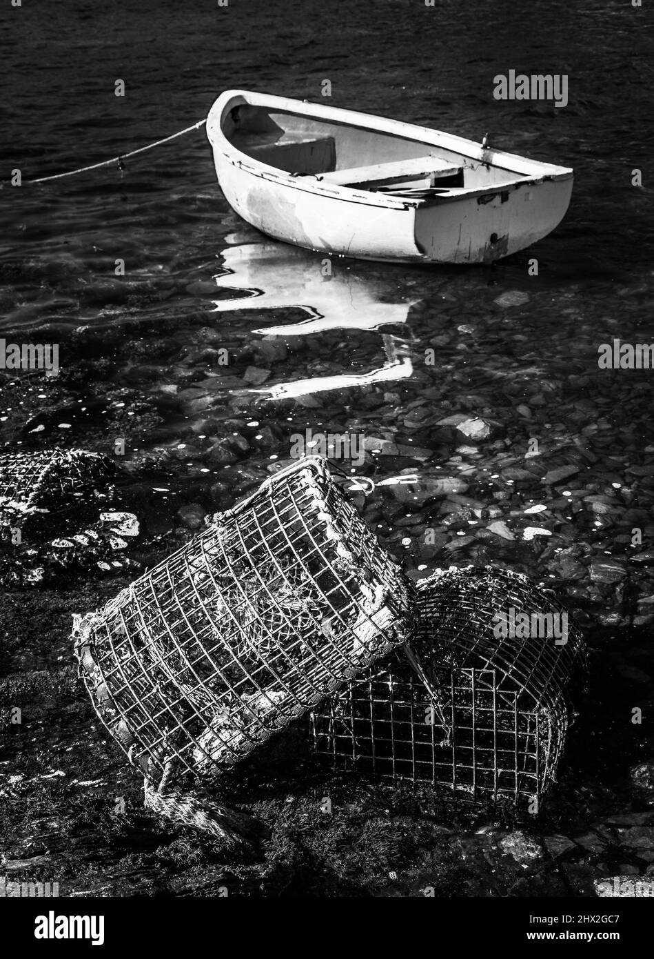 Lobster creels and moored boat on Killary Bay Little, Connemara, County Galway, Ireland. Stock Photo