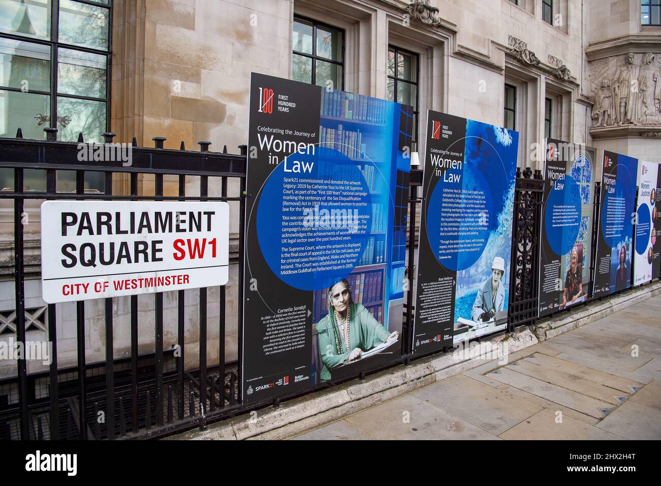 Westminster, London, UK. 8th March, 2022. Banners on the railings