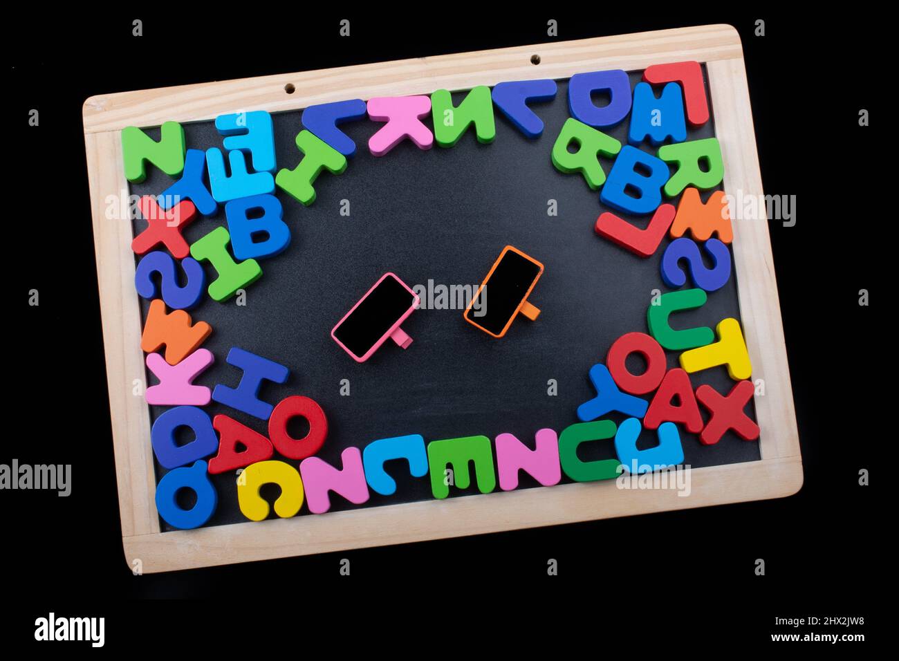 Notice board and Colorful Letters of Alphabet made of wood Stock Photo