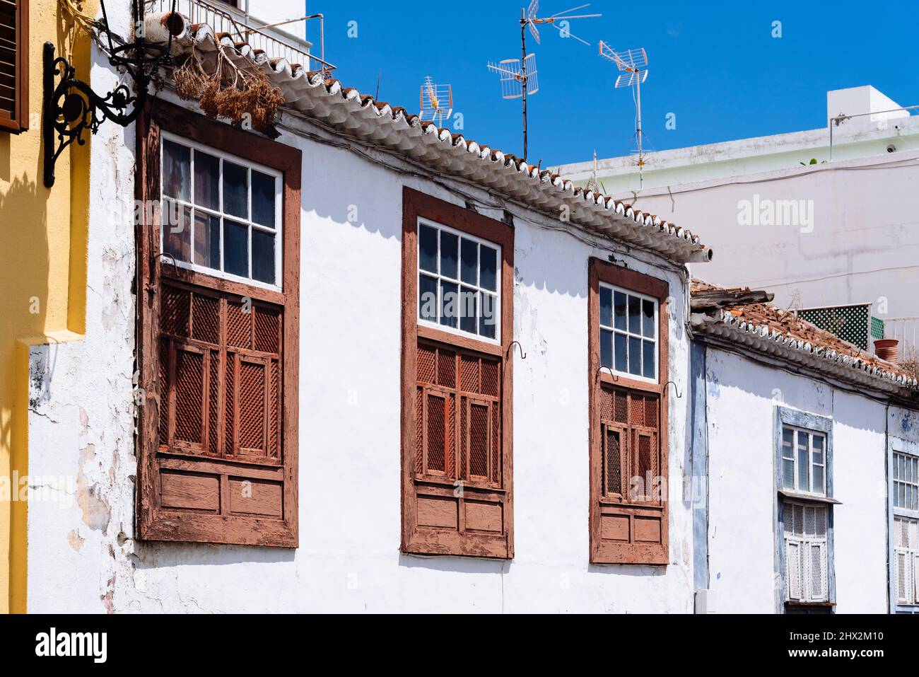 Traditional colonial architecture of Canary islands with colorful houses in the capital of La Palma, Santa Cruz de la Palma. San Telmo Street in the Stock Photo