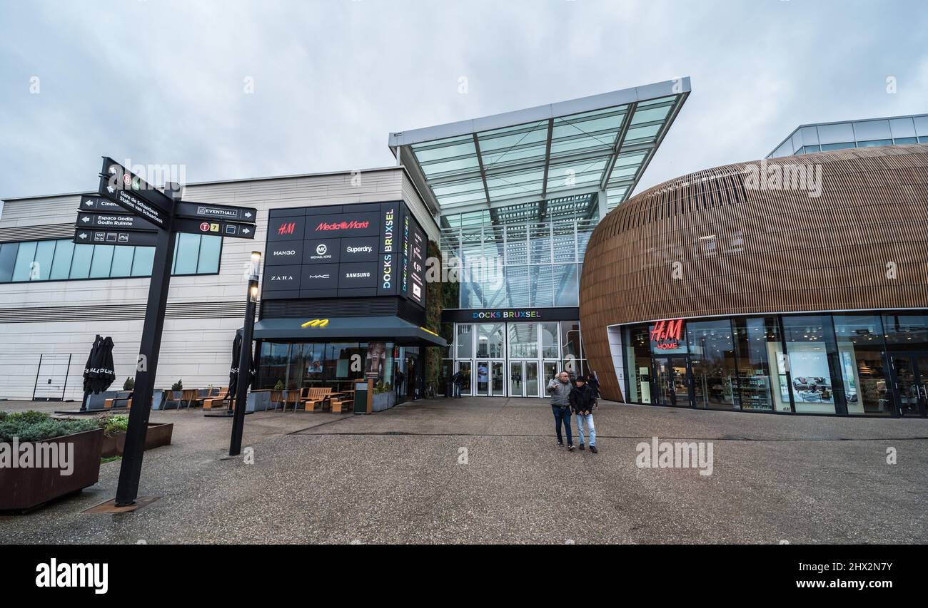 Schaerbeek, Brussels / Belgium: Inner court and glass overhang of the docks  bruxsel shopping mall during a rainy day Stock Photo - Alamy