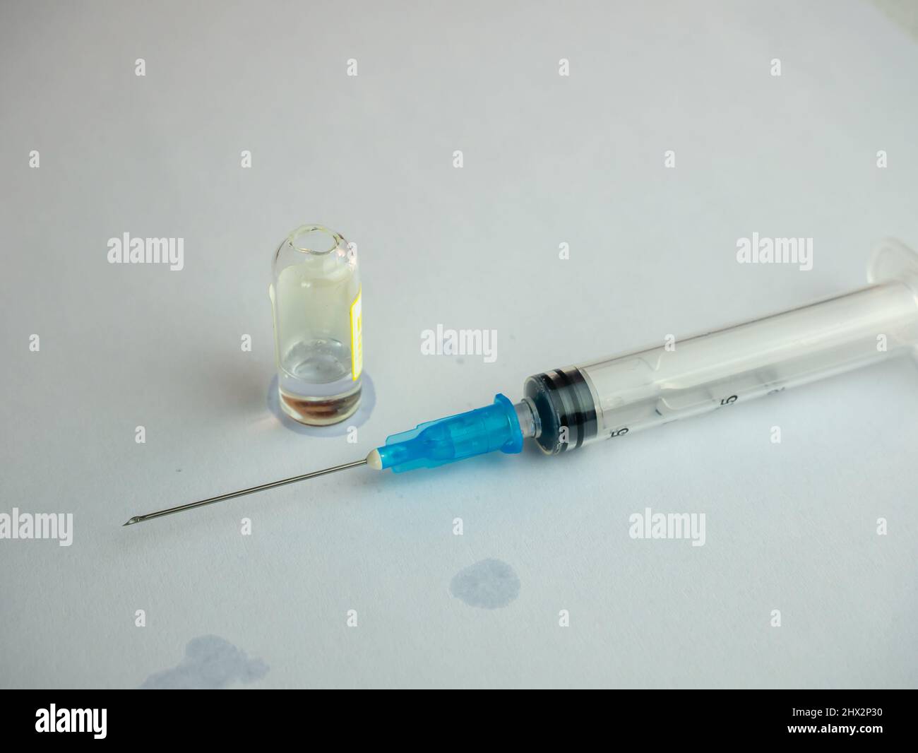 Syringe with needle medical glass open ampoule with liquid Stock Photo