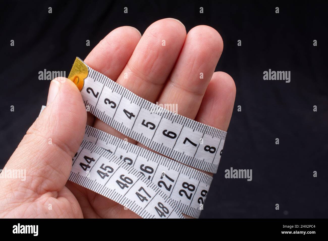 soft measuring tape. tape measure with metric scale. Stock Photo