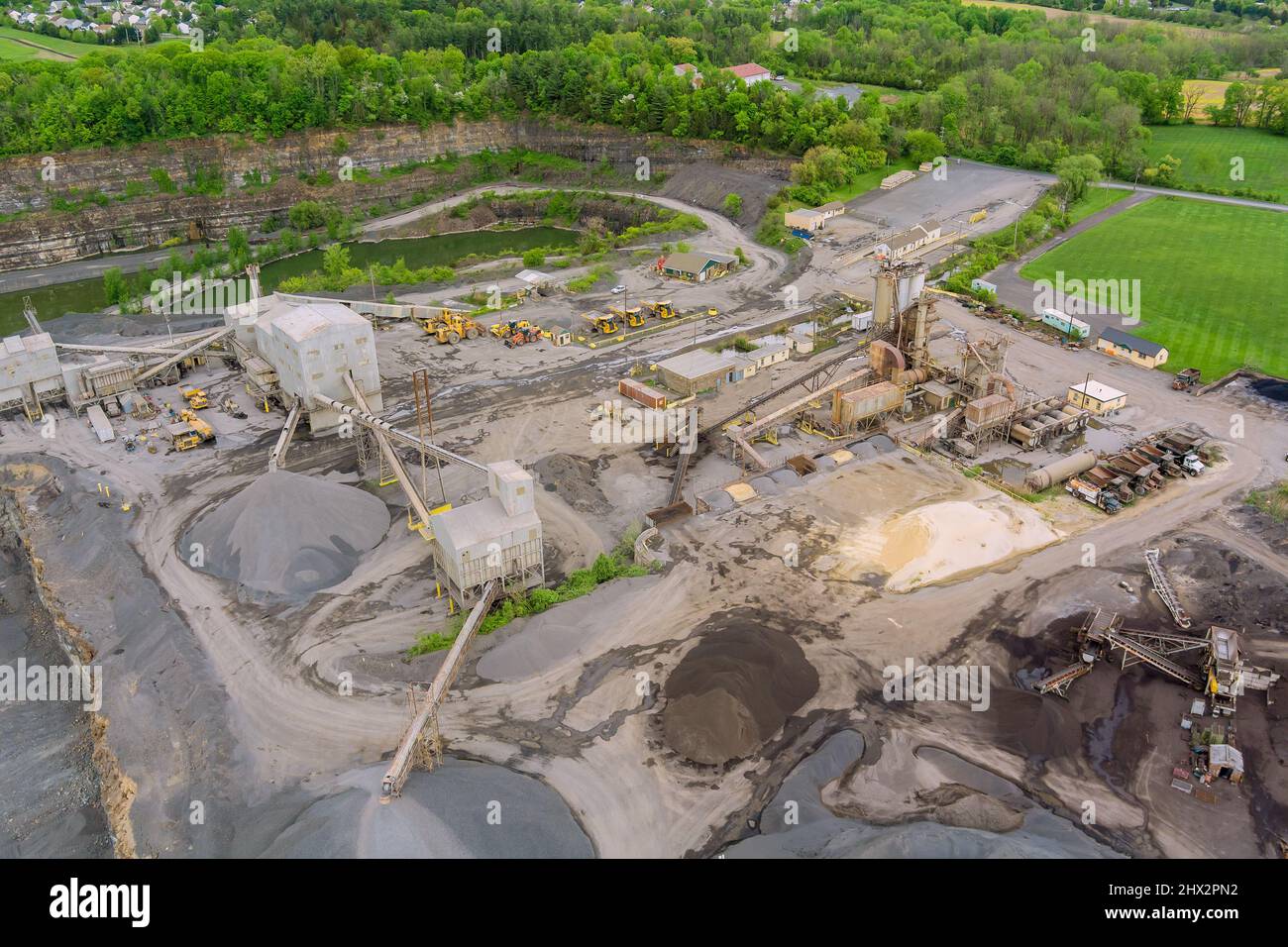 Mobile Stone crusher machine by the construction site or mining quarry for  crushing old concrete slabs into gravel and subsequent cement production  Stock Photo - Alamy