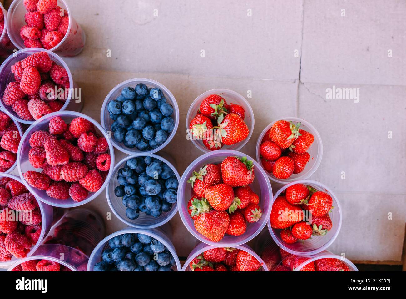 Fresh berries on the market. Ripe beautiful berries in boxes Stock Photo Alamy