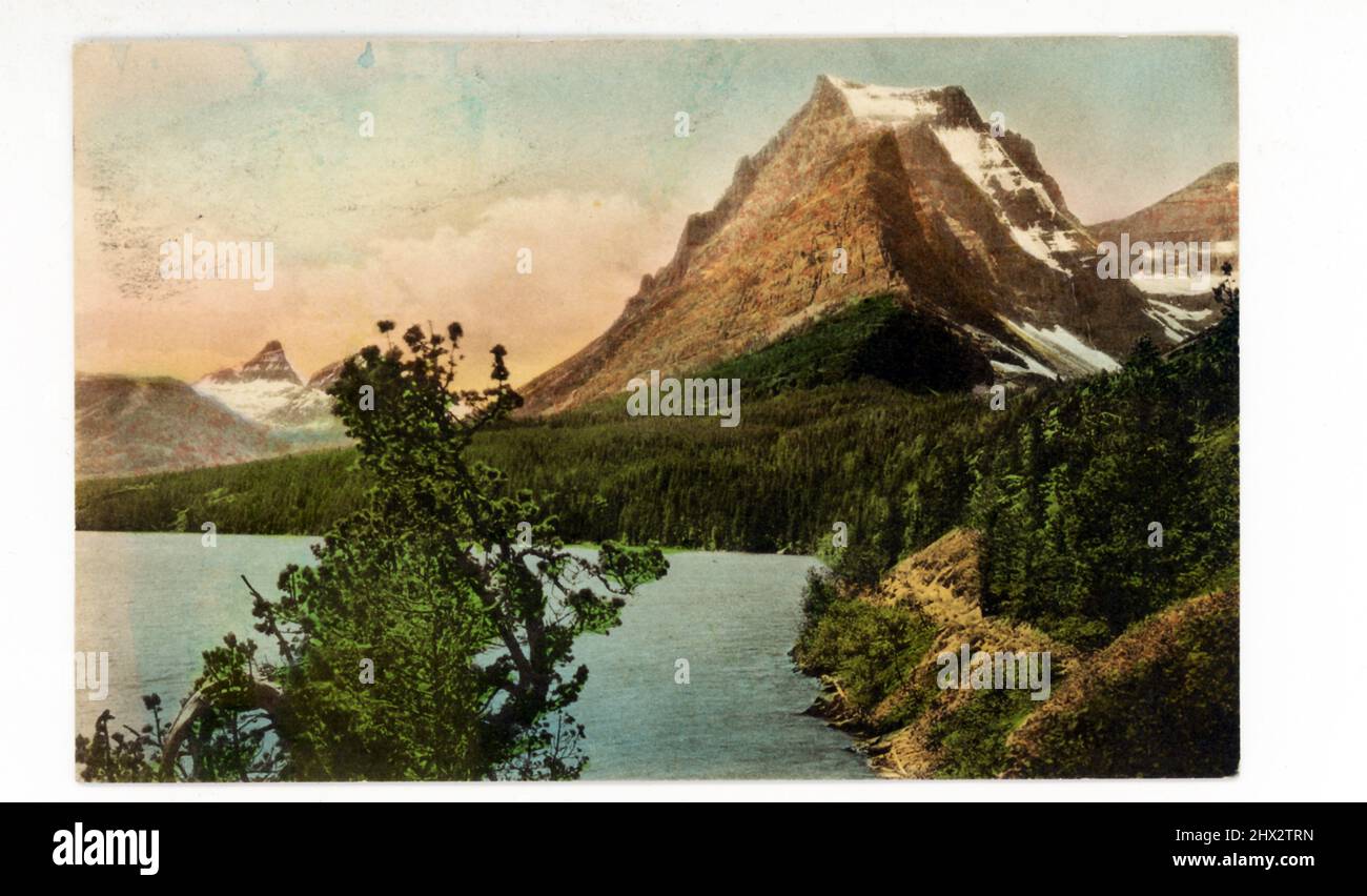 This vintage postcard, dating to the 1930s, shows Going to the Sun Road Mountain at Glacier National Park. One of the most amazing highlights of Stock Photo