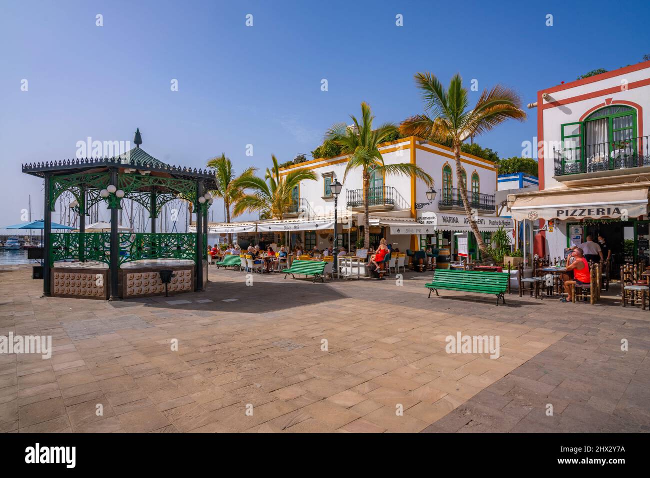 View of bandstand, cafes and shops along the promenade in the old town, Puerto de Mogan, Gran Canaria, Canary Islands, Spain, Europe Stock Photo