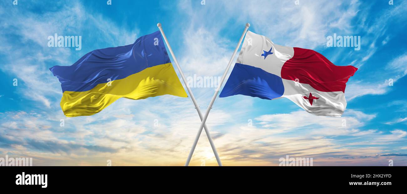crossed national flags of Ukraine and Panama flag waving in wind at ...
