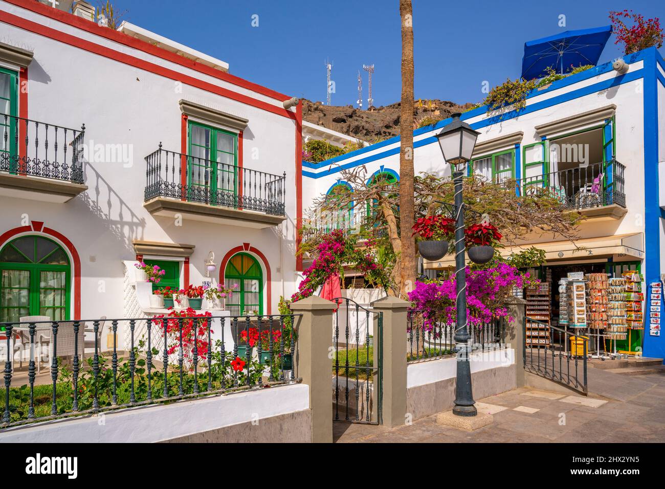 View of colourful buildings and flowers in the old town, Puerto de Mogan, Gran Canaria, Canary Islands, Spain, Europe Stock Photo