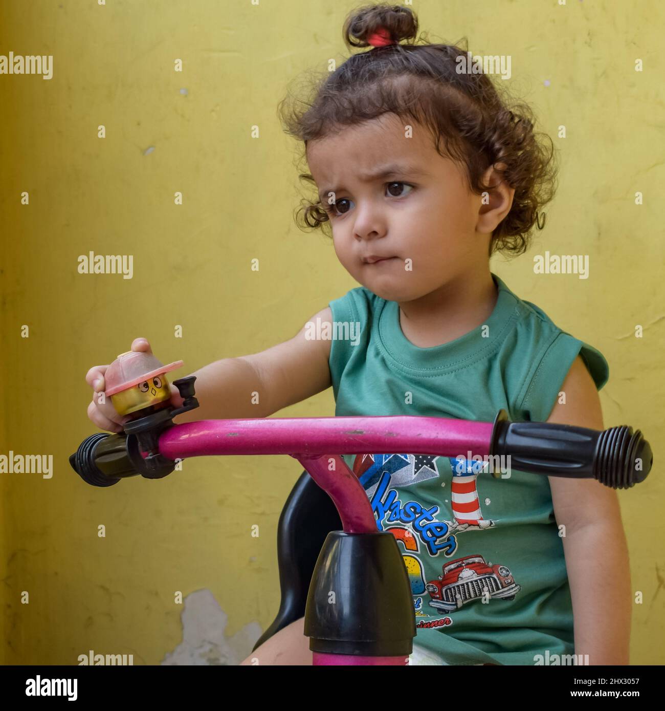 Cute little boy Shivaay driving cycle at home balcony during