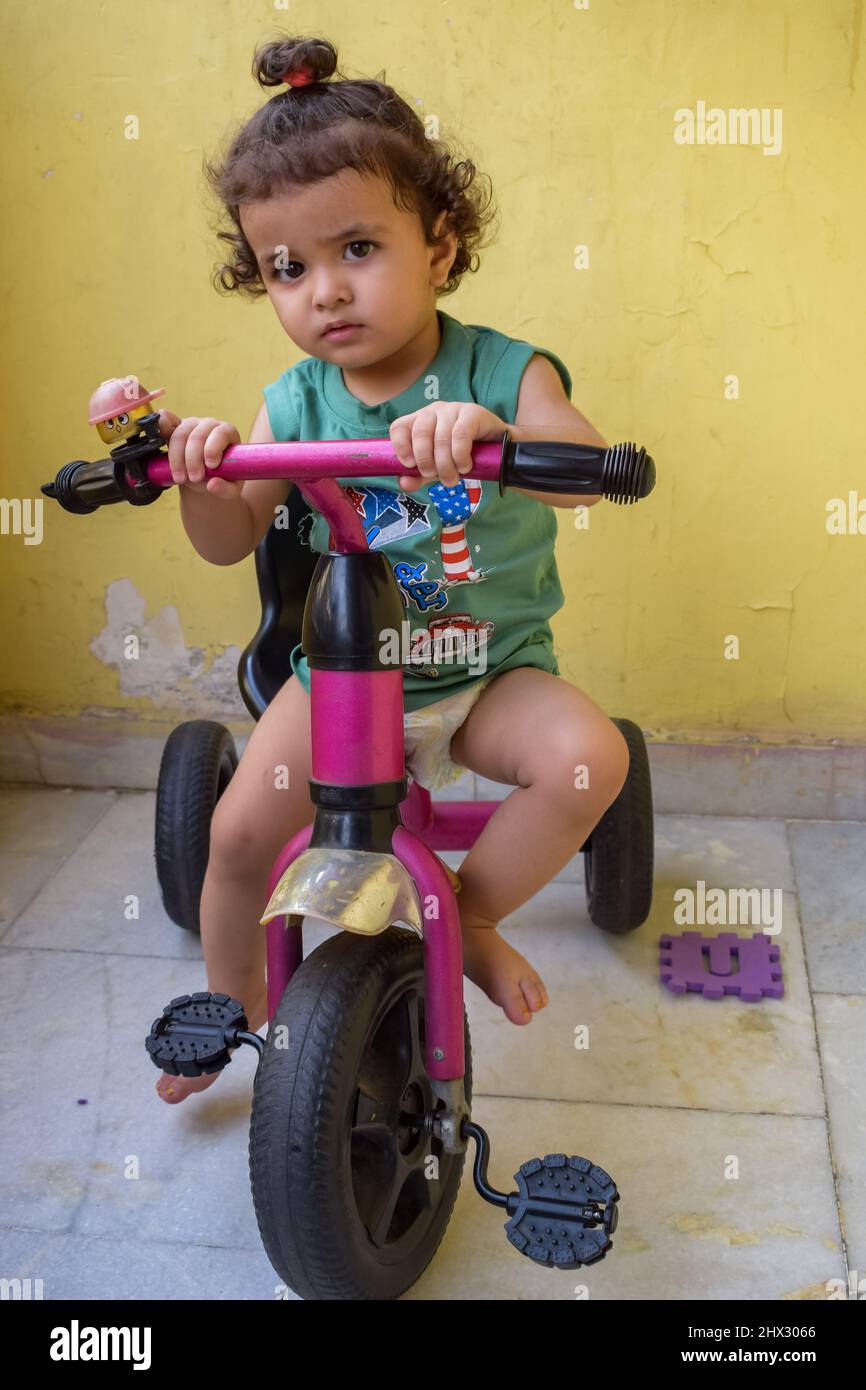 Cute little boy Shivaay driving cycle at home balcony during summer time Sweet little boy photoshoot during day light Little boy enjoy cycling at ho Stock Photo Alamy