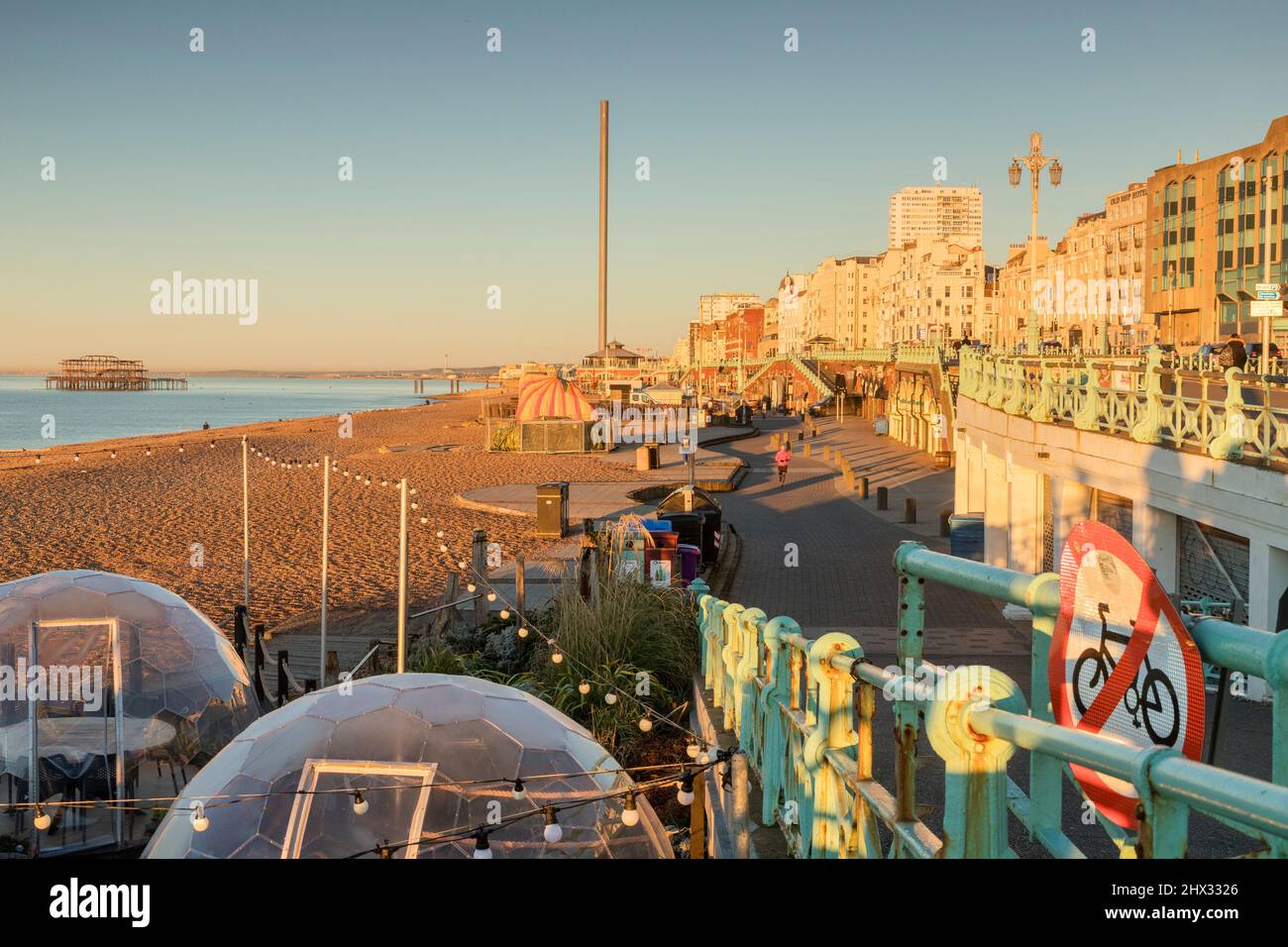 14 January 2022: Brighton, East Sussex, UK - Early morning on Brighton Promenade, With the old West Pier, in winter. Stock Photo