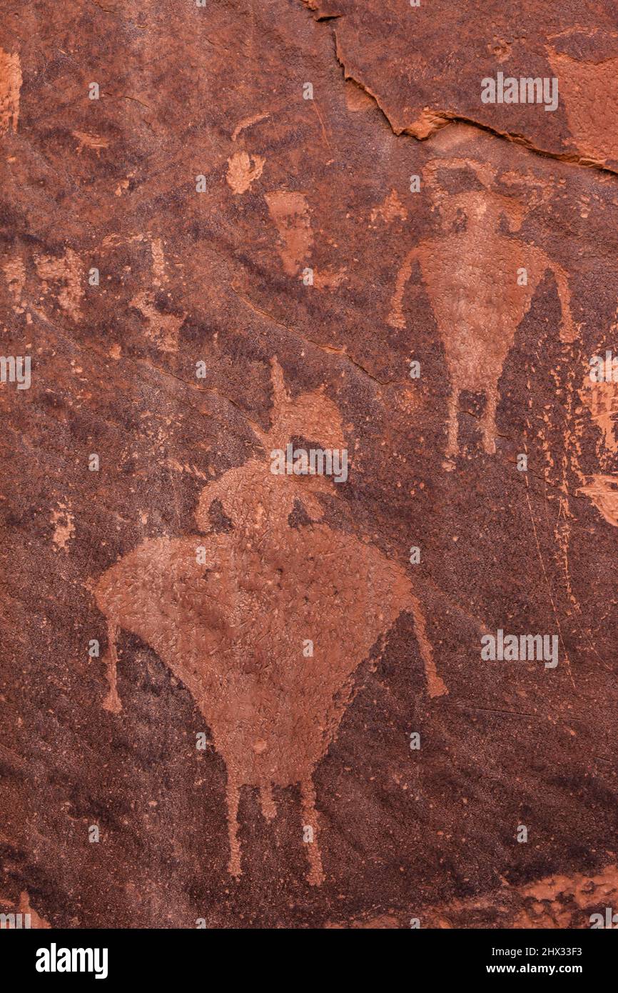 The Desecration Panel is a long group of rock art panels along the San Juan River in Utah.  The were made by the Basketmaker Culture between 1500 BC - Stock Photo