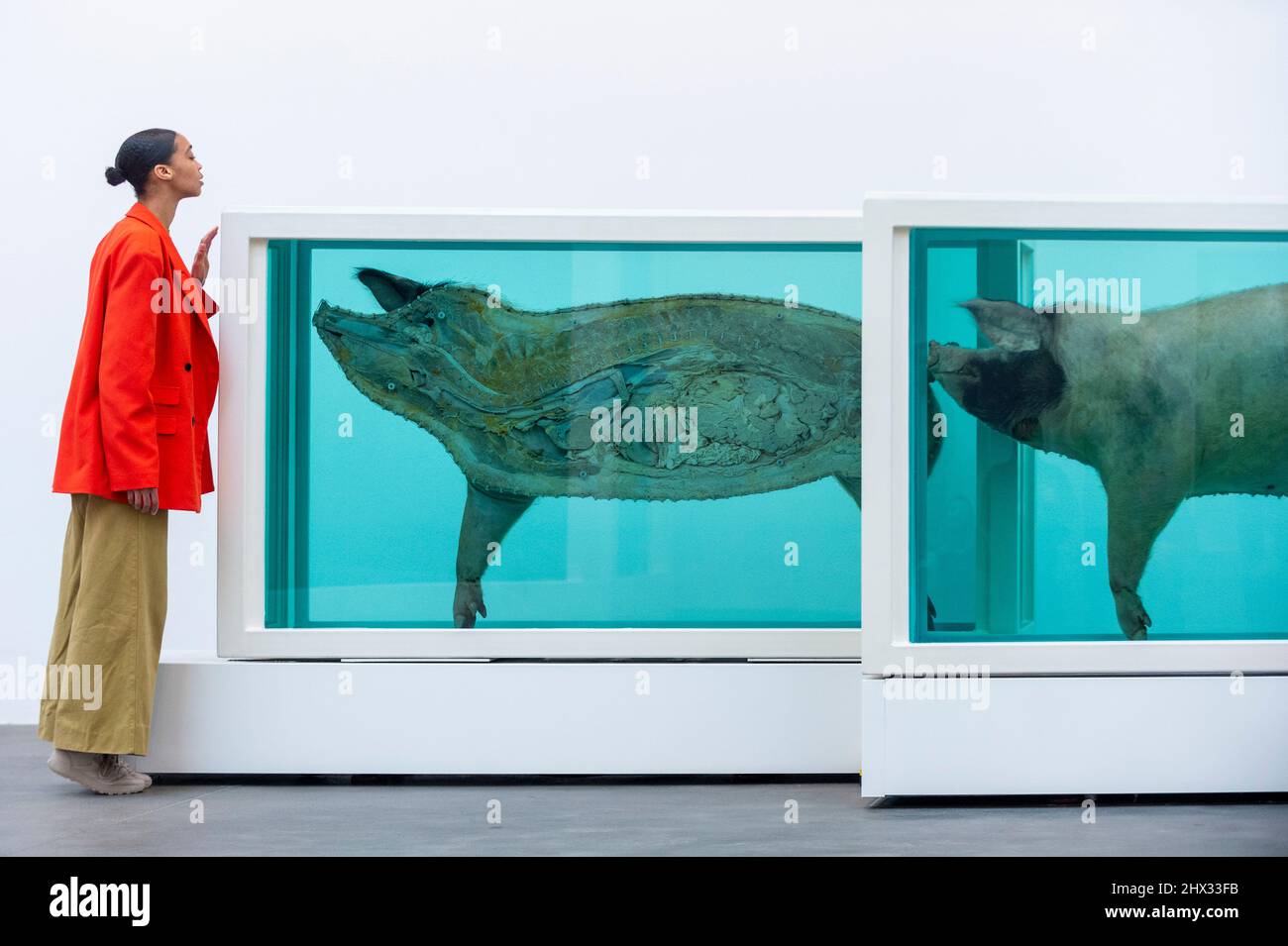 London, UK. 9 March 2022. A staff member views “This Little Piggy Went