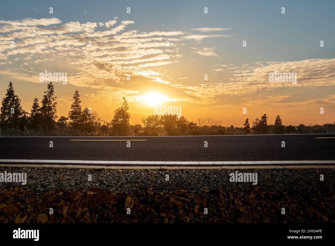 Asphalt road and beautiful sky clouds at sunset Stock Photo - Alamy