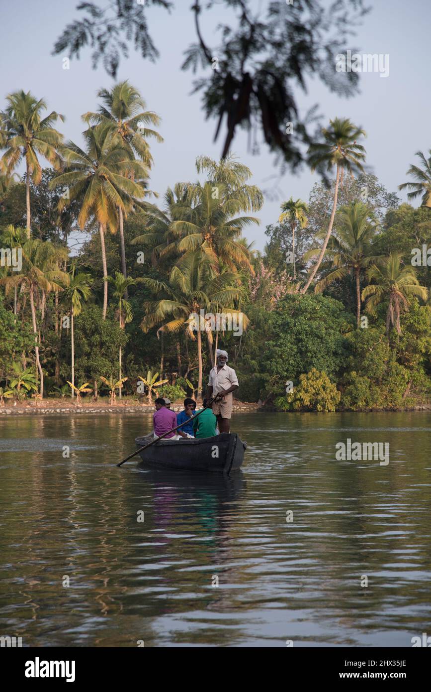 Primitive wooden transport boat in the Backwaters of Kerala, India