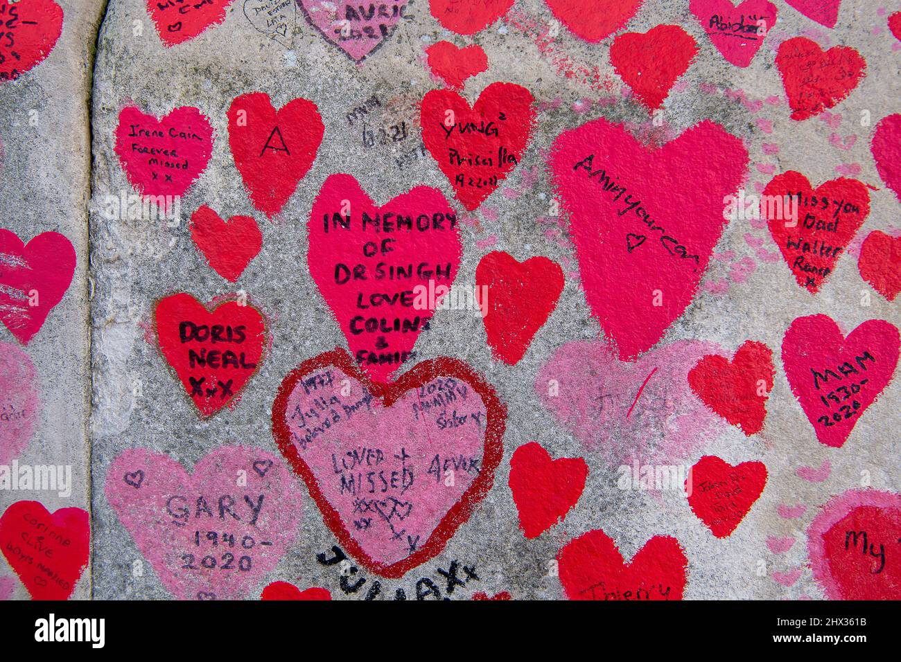 London, UK. 8th March, 2022. The National Covid Memorial Wall next to the River Thames in London by St Thomas' Hospital. The red hearts are repainted on a regular basis so as to not forget all those who have died of Covid-19 since the Pandemic started . Credit: Maureen McLean/Alamy Stock Photo