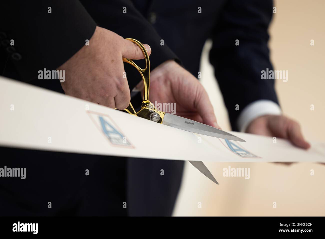 Essen, Germany. 09th Mar, 2022. Golden scissors are used to ...