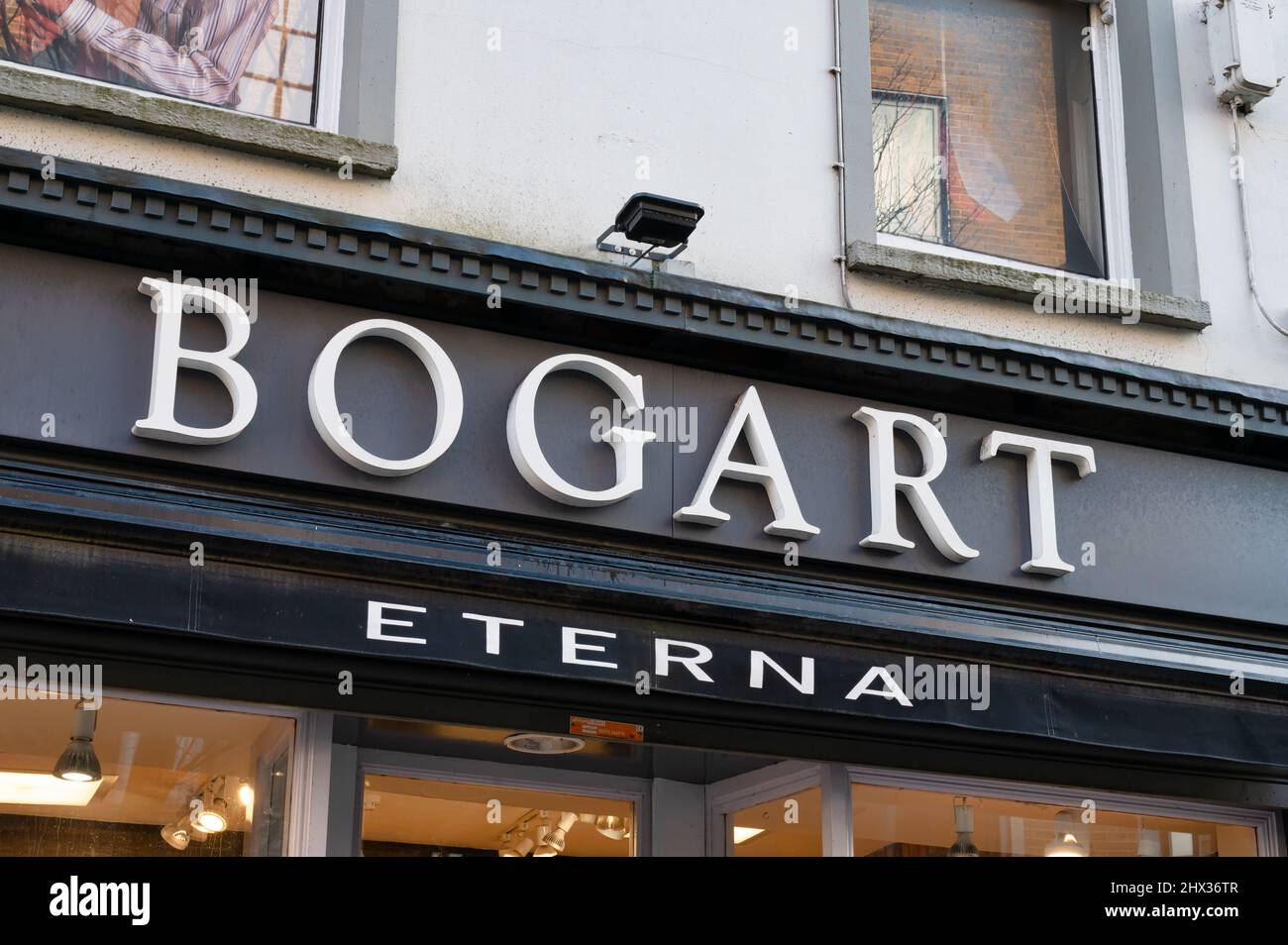 Belfast, UK- Feb 19, 2022: The sign for Bogart Menswear store in Belfast Northern Ireland. Stock Photo