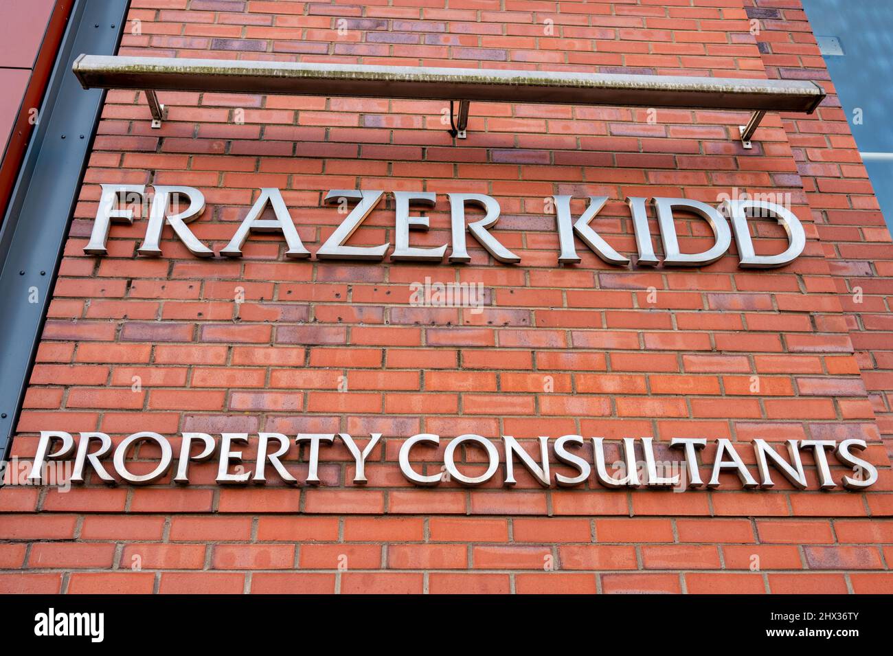 Belfast, UK- Feb 19, 2022: The sign for Frazer Kidd Property Consultants in Belfast Northern Ireland. Stock Photo