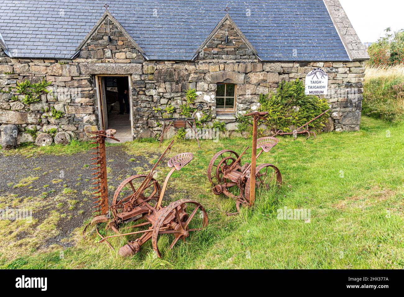 Old agricultural implements outside Staffin Ecomuseum near Ellishadder on the north east coast of the Isle of Skye, Highland, Scotland UK. Stock Photo