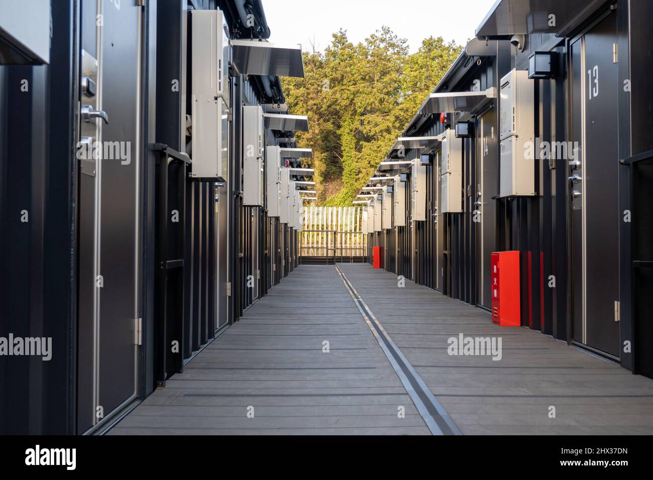 Exterior doors along corridor at hotel made from shipping containers Stock Photo