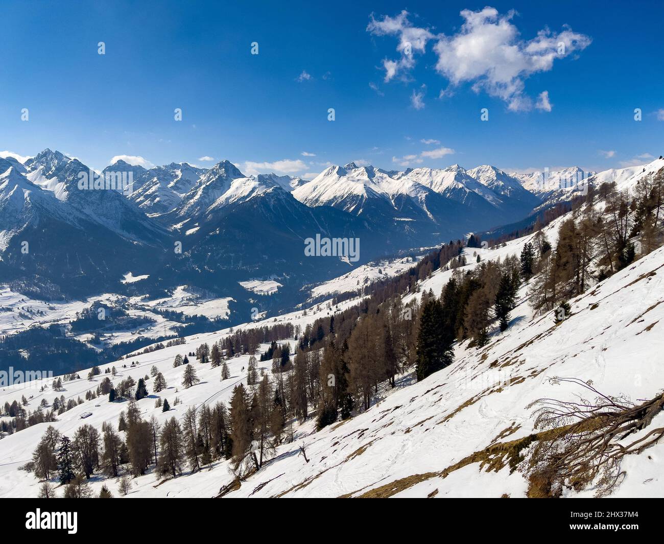 a panorama of the swiss alps in winter with blue sky Stock Photo - Alamy