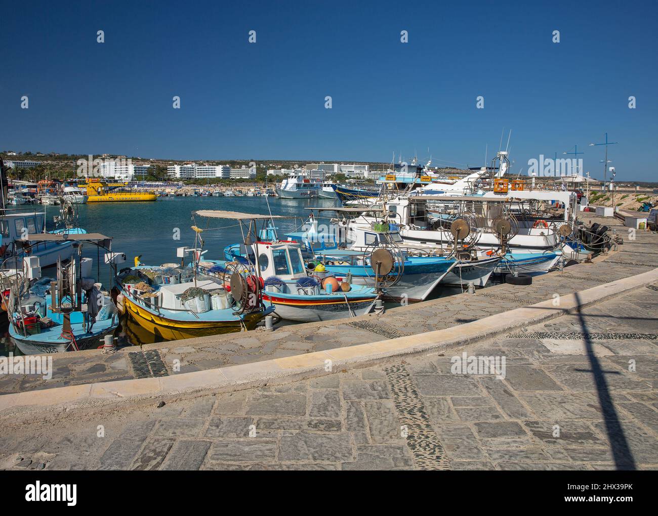 Ayia Napa, Cyprus - May 23, 2021: Boats and ships moored in seaport. Ayia Napa is a tourist resort at the far eastern end of the southern coast of Cyp Stock Photo