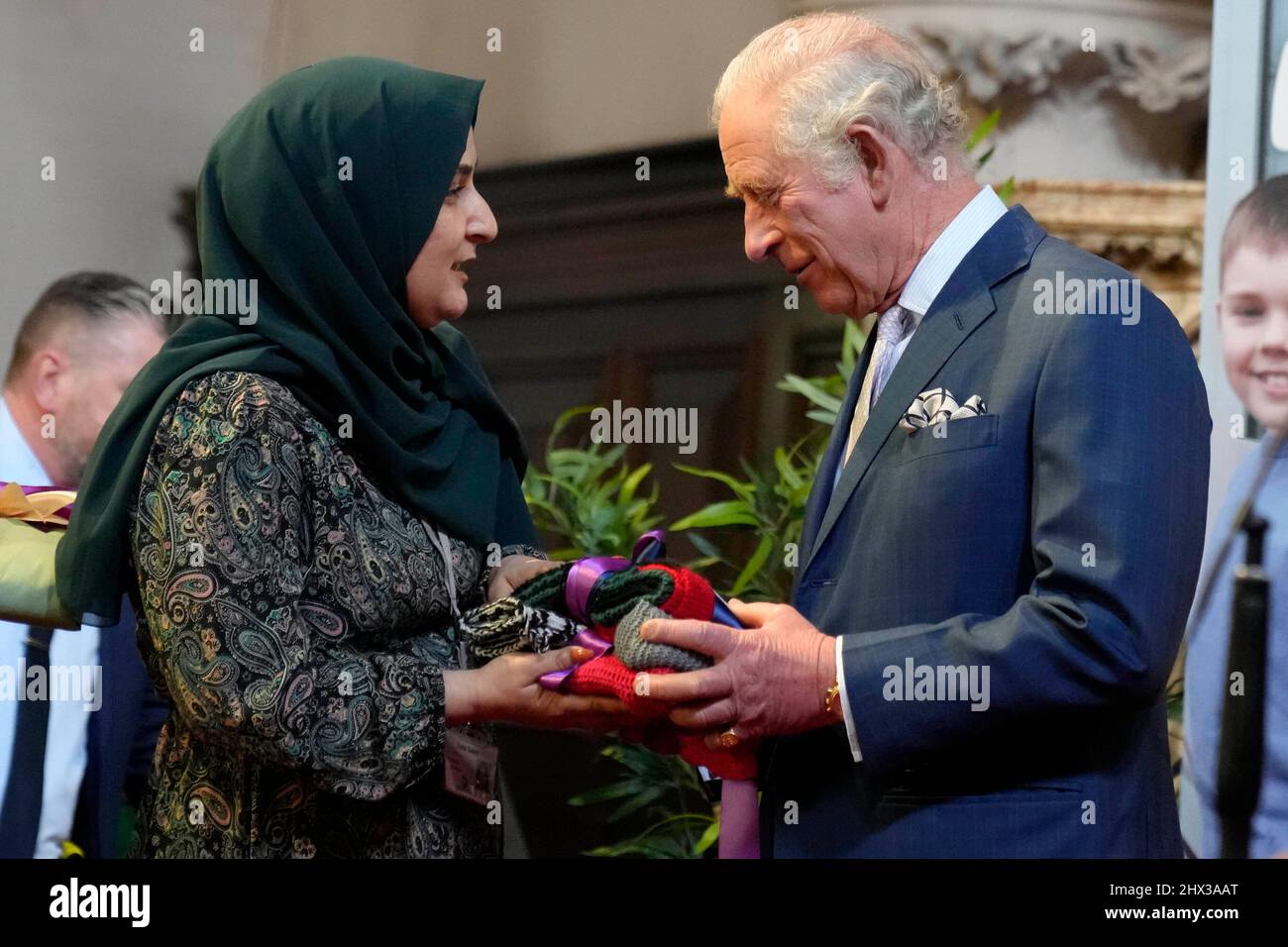 The Prince of Wales receives a gift during a visit to St Luke's Church, Earl's Court, west London, to learn about the work of Holy Trinity Brompton in supporting refugees and asylum seekers. Picture date: Wednesday March 9, 2022. Stock Photo