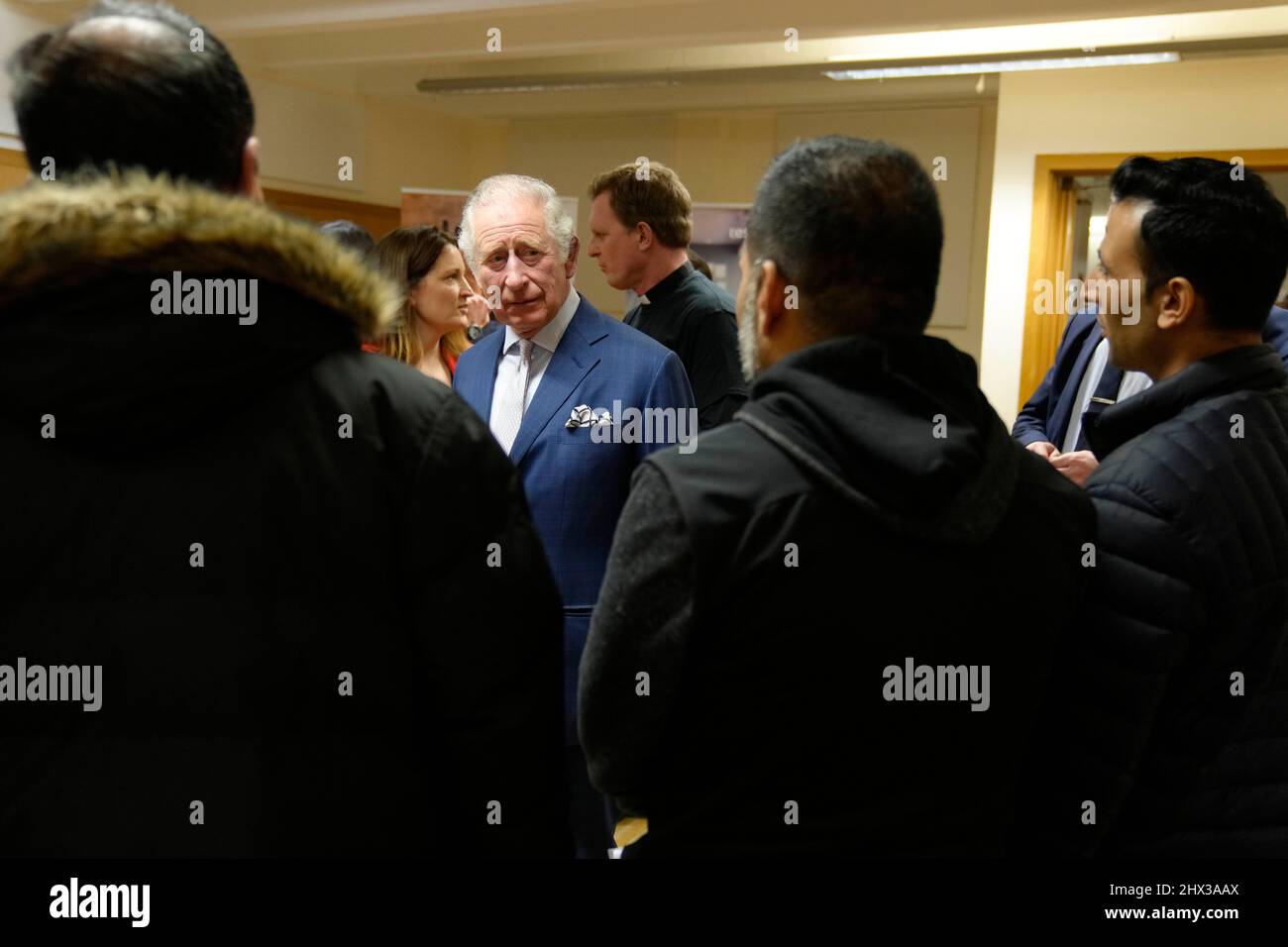 The Prince of Wales (centre) during a visit to St Luke's Church, Earl's Court, west London, to learn about the work of Holy Trinity Brompton in supporting refugees and asylum seekers. Picture date: Wednesday March 9, 2022. Stock Photo