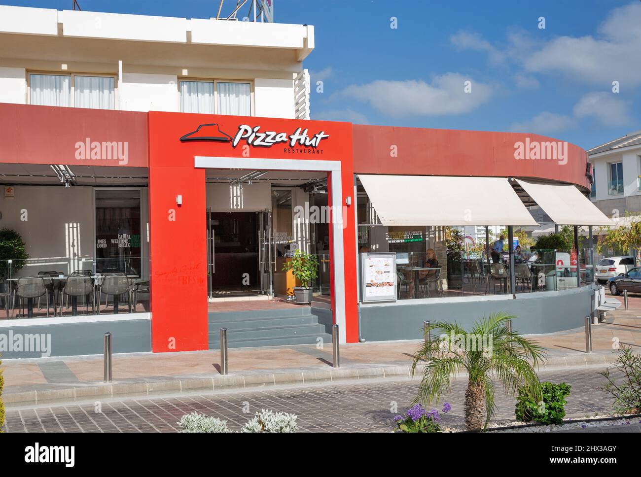Ayia Napa, Cyprus - May 28, 2021: Pizza Hut restaurant, an American multinational chain founded 1958. They serve their signature pan pizza and other d Stock Photo