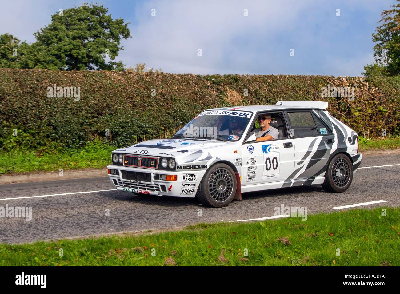 1991 90s nineties white Lancia Delta HF Turbo 4WD Repsol Rally Race Course Car; en-route to Leighton Hall classic August car show Carnforth, UK Stock Photo
