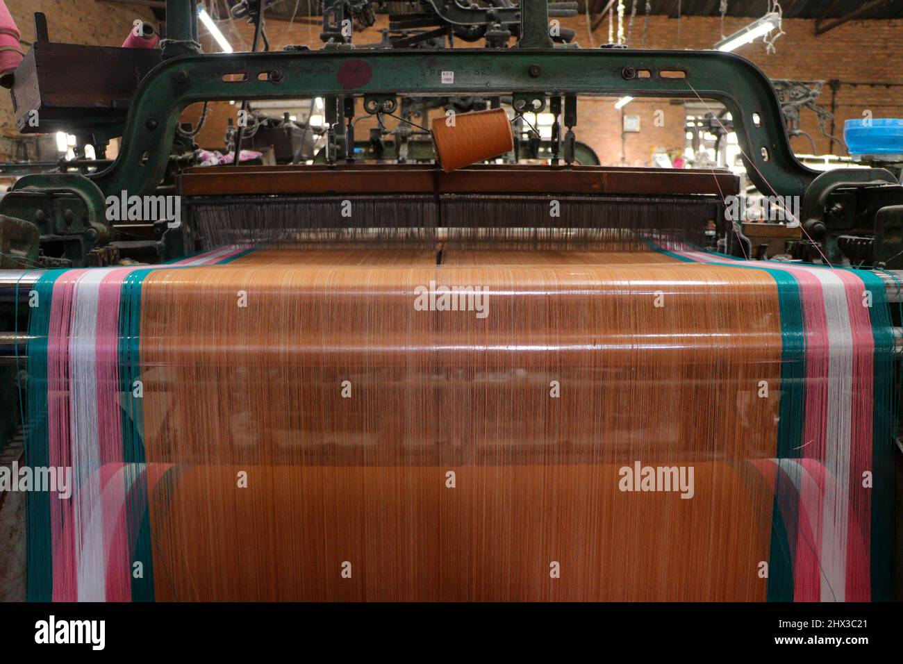 Kathmandu, NE, Nepal. 9th Mar, 2022. A Cloth weaving machine is