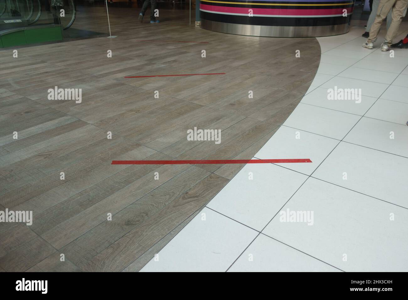 Dividing stripes in a supermarket. Two meter distance between people Stock Photo