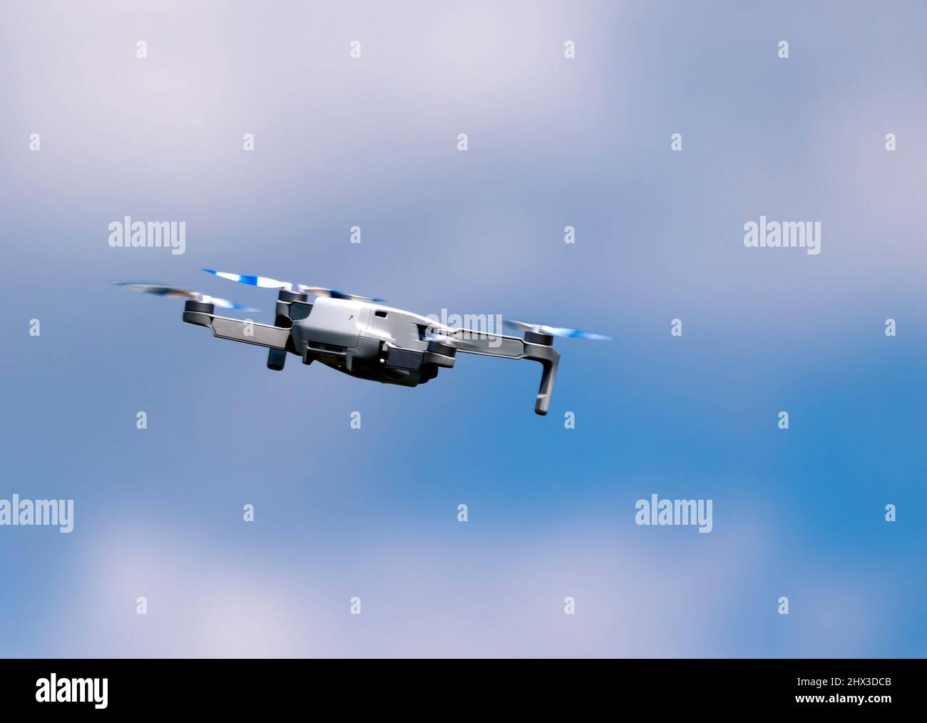 Flying drone in the sky with mounted digital camera Stock Photo - Alamy