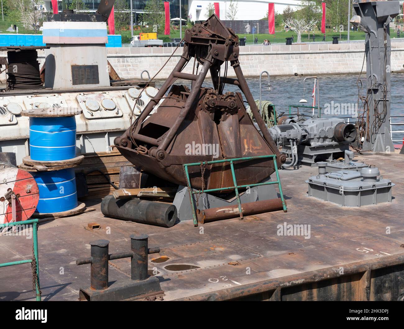 Closeup of an old rusty clamshell bucket from wire ropes and chains. Stock Photo