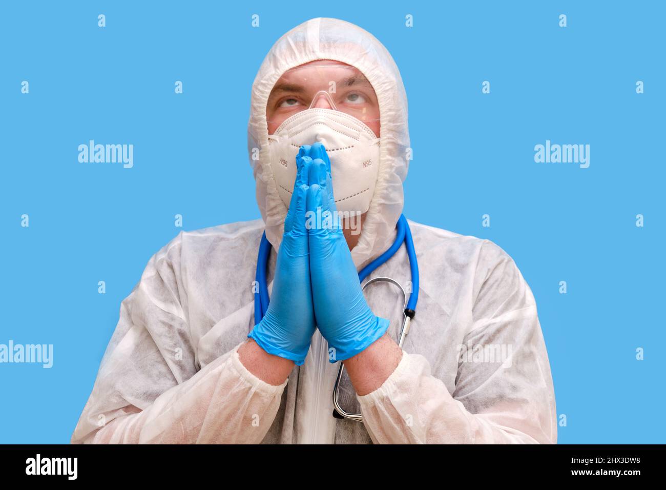 Man doctor medic in a protective suit uniform with goggles and face ...