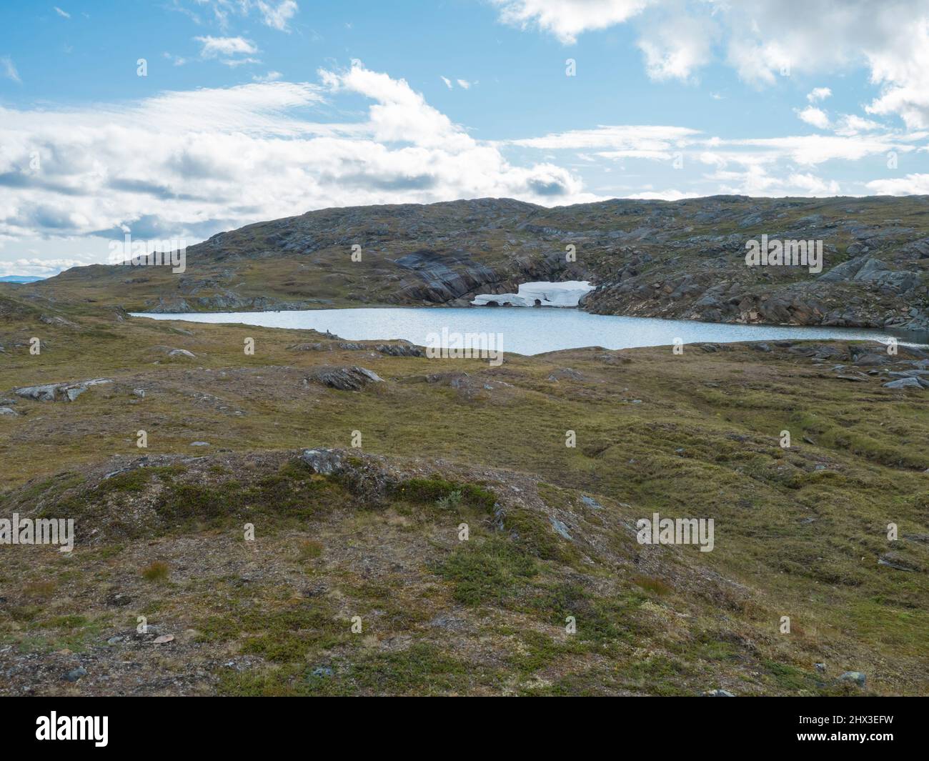 Northern landscape, tundra in Swedish Lapland with blue artic lake with