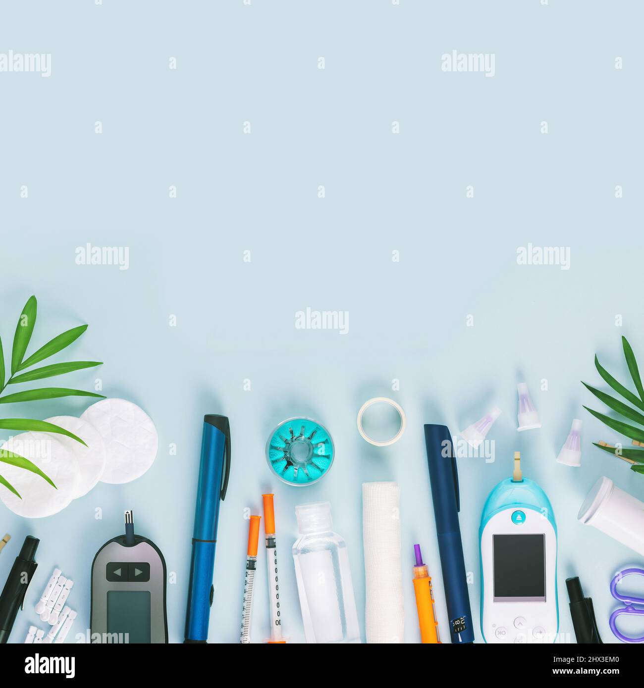 Diabetic disease banner with glucose meter, test strips for determining blood sugar levels, syringes for insulin injections, needles, sanitizing on a Stock Photo