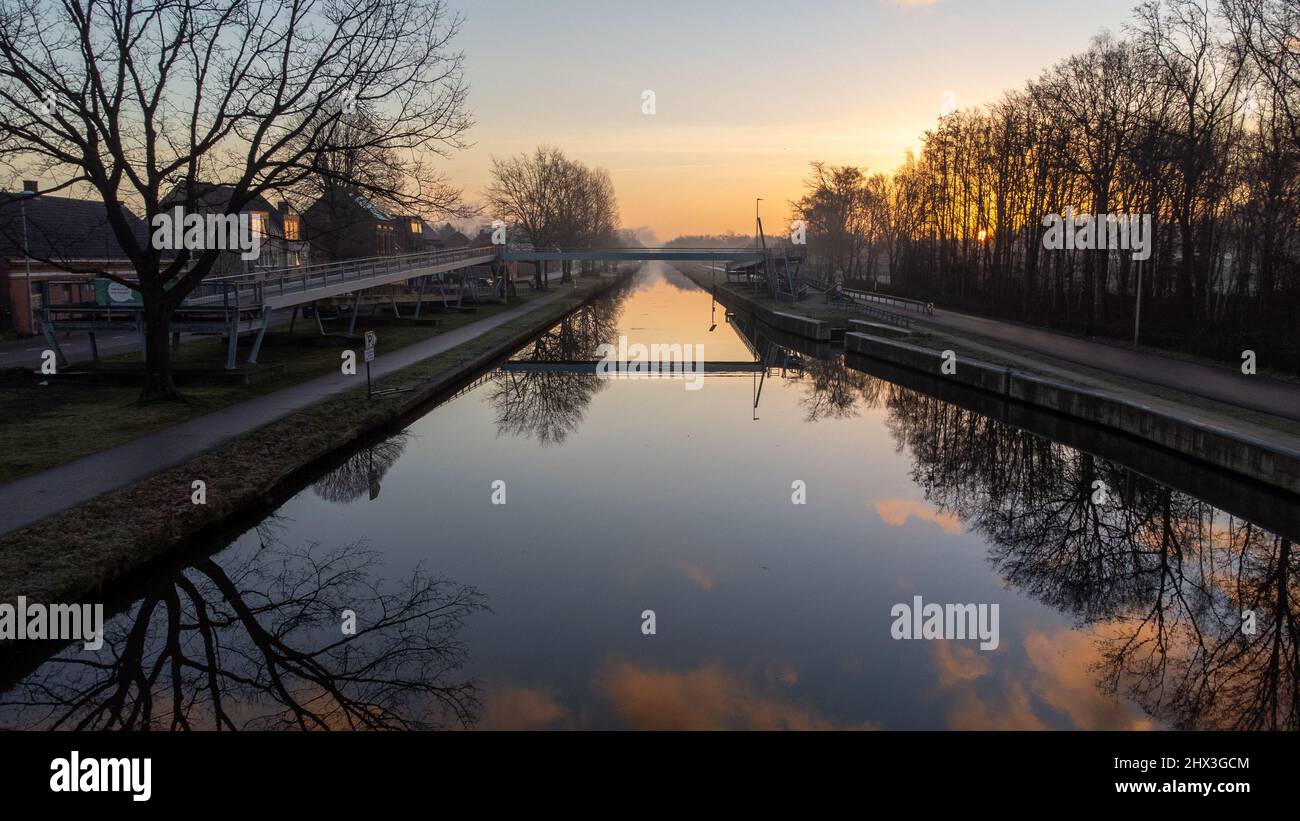 Beautiful sunrise or sunset with a colorful dramatic sky over a river ...