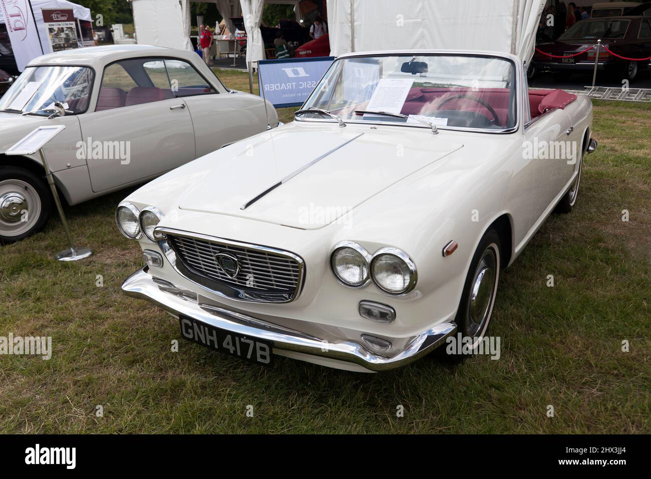 Three-quarter Front view of a  White, 1964, Lancia Flavia Cabriolet by Vignale, on display at the 2021 London Classic Car Show Stock Photo