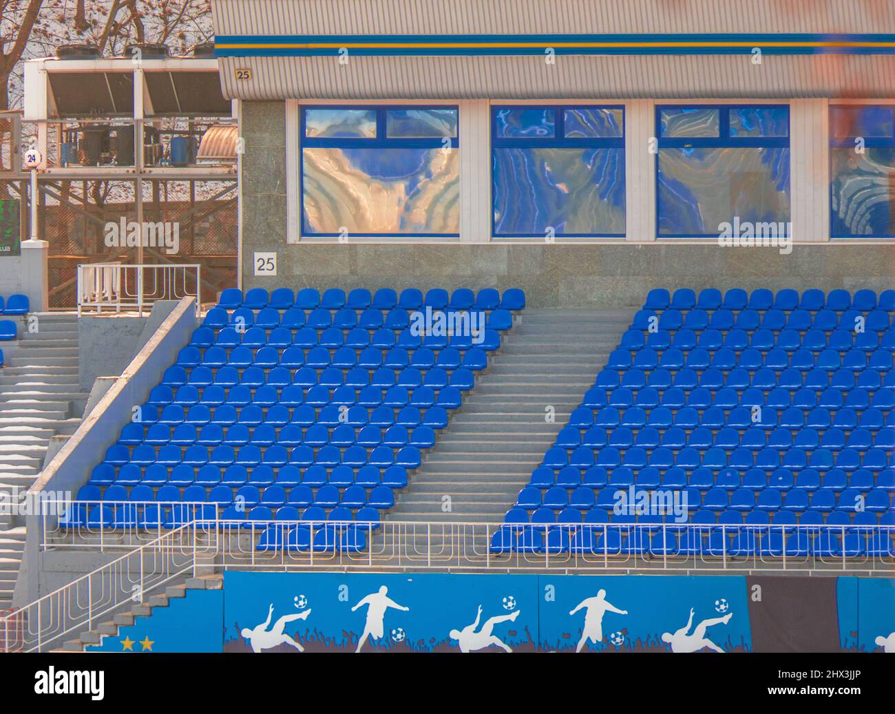 The rows of seats in the stadium are white and blue Stock Photo Alamy