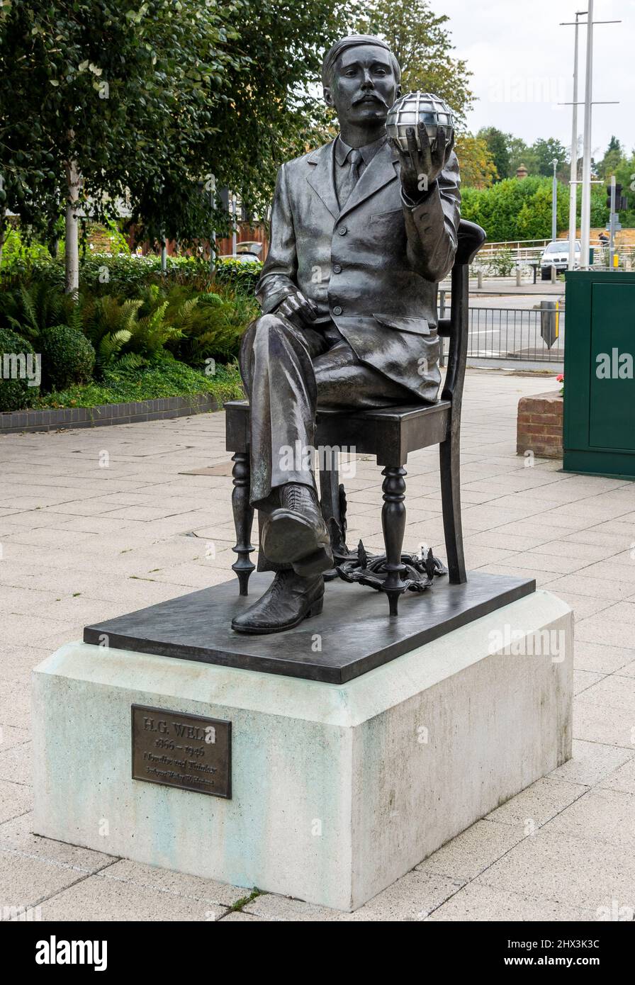 Sculpture of H. G. Wells by sculptor Wesley W. Harland on display outside the McLaren Group building, Victoria Gate, Woking, England, UK Stock Photo