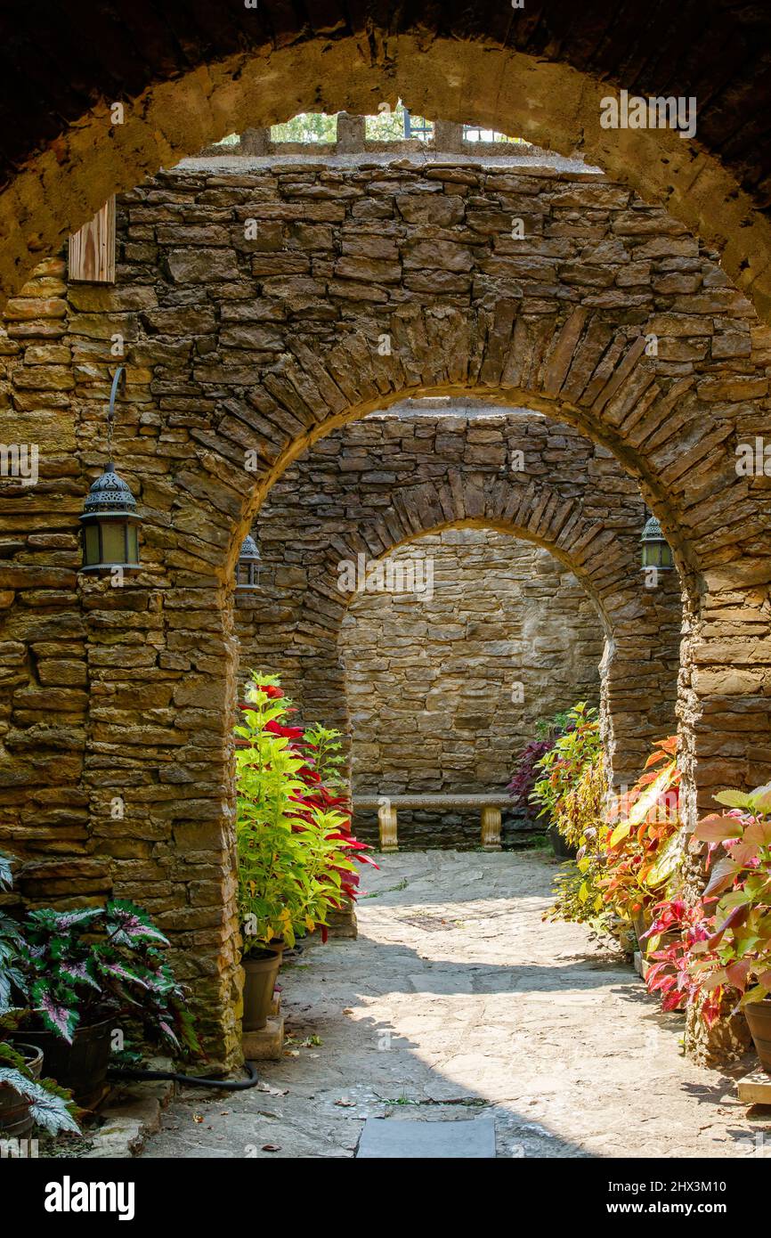 Arches and plant lined walk. Loveland Castle Chateau Laroche. Medieval style castle built by Harry D Andrews. Loveland, Cincinnati, Ohio, USA. Stock Photo
