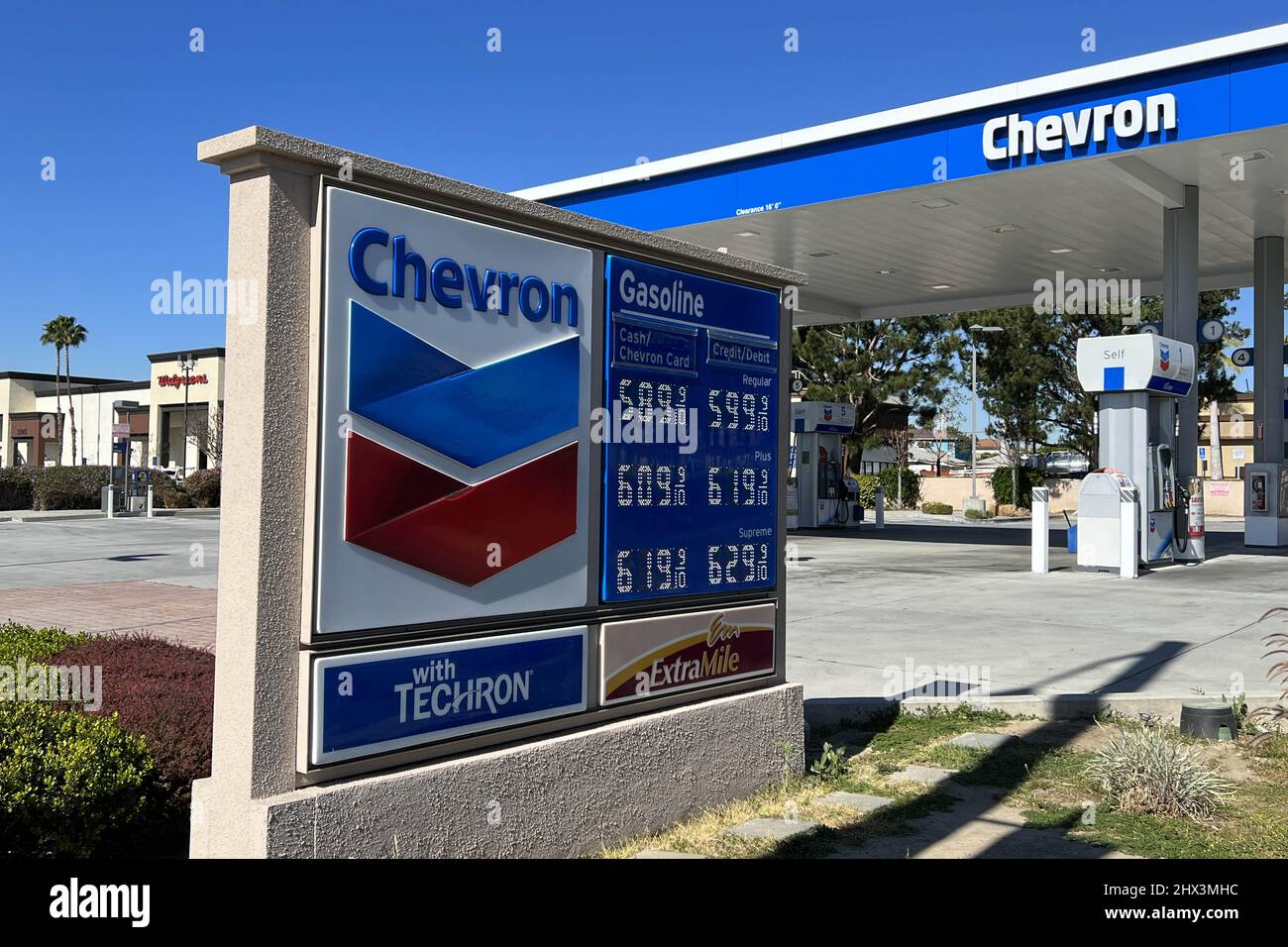 Gas prices per gallon are displayed at a Chevron ExtraMile convenience