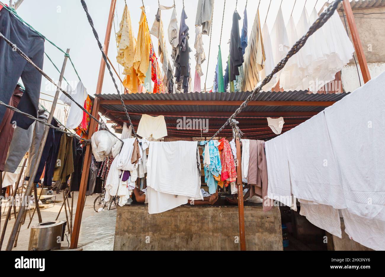 Clean freshly washed clothes and towels hanging out to dry in the open air in Mahalaxmi Dhobi Ghat, a large open air laundromat in Mumbai, India Stock Photo